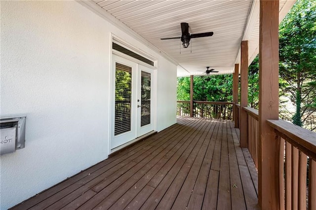 wooden deck featuring ceiling fan