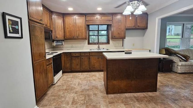 kitchen with range with electric cooktop, a sink, ceiling fan, light countertops, and crown molding
