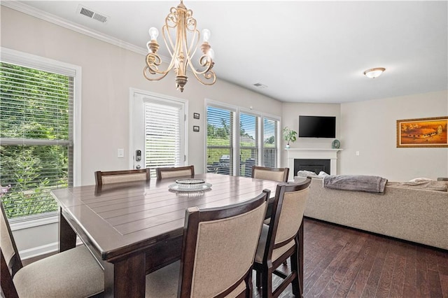 1655 Hampton Oaks Dr, Alpharetta, GA 30004 - dining space featuring a chandelier, dark wood finished floors, and a fireplace