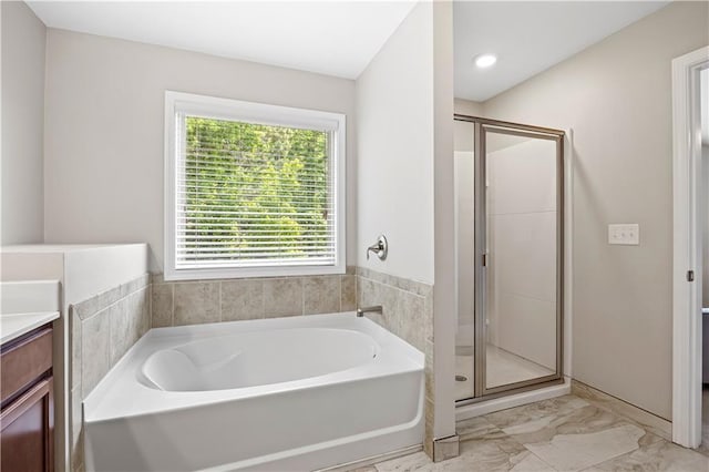 1655 Hampton Oaks Dr, Alpharetta, GA 30004 - full bath featuring a garden tub, vanity, a stall shower, and marble look tile flooring