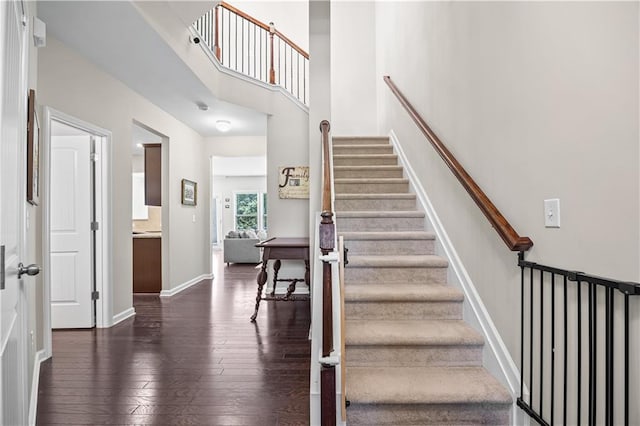 1655 Hampton Oaks Dr, Alpharetta, GA 30004 - staircase with hardwood / wood-style flooring and a towering ceiling