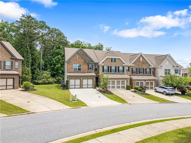 1655 Hampton Oaks Dr, Alpharetta, GA 30004 - view of property with driveway, brick siding, and an attached garage