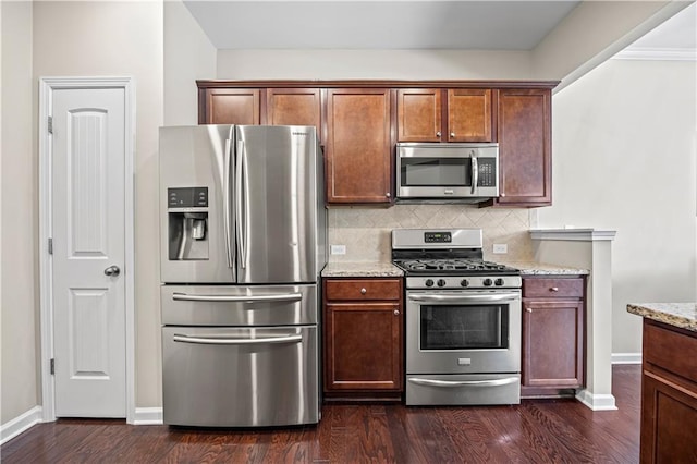 1655 Hampton Oaks Dr, Alpharetta, GA 30004 - kitchen with stainless steel appliances, decorative backsplash, dark wood-type flooring, and light stone countertops