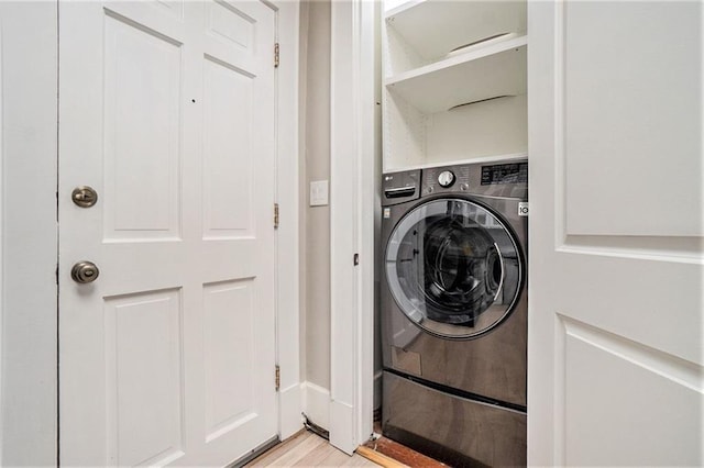 1156 Piedmont Ave NE Unit B3, Atlanta, GA 30309 - laundry room with washer / clothes dryer and light wood-type flooring