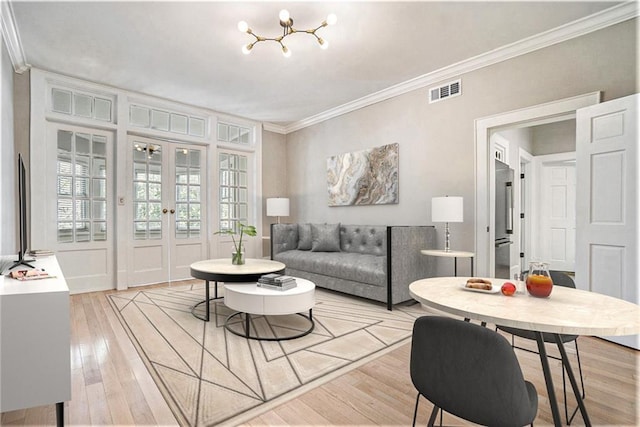1156 Piedmont Ave NE Unit B3, Atlanta, GA 30309 - living area featuring ornamental molding, light wood-style floors, french doors, and a chandelier