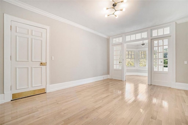 1156 Piedmont Ave NE Unit B3, Atlanta, GA 30309 - spare room with a chandelier, ornamental molding, light wood-style floors, baseboards, and a ceiling fan