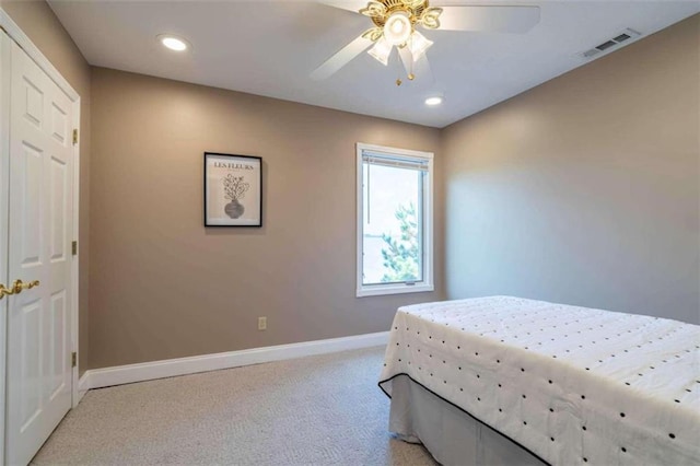 bedroom featuring visible vents, recessed lighting, baseboards, and light carpet