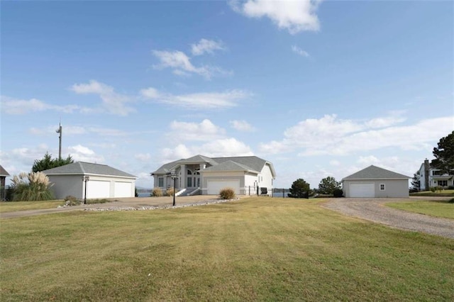 single story home with a front yard and a garage