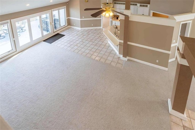 interior space featuring carpet floors, tile patterned flooring, baseboards, ceiling fan, and recessed lighting