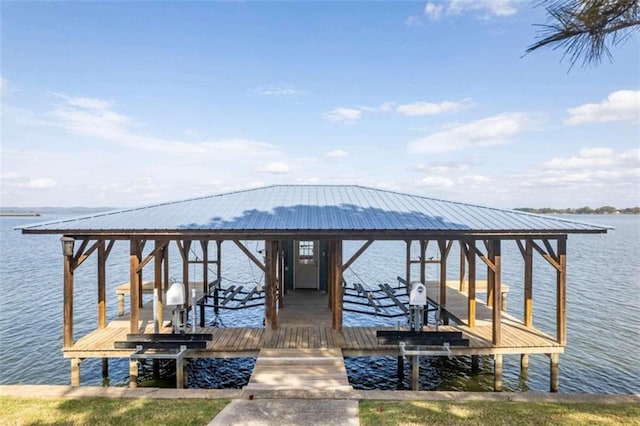 view of dock with boat lift and a water view