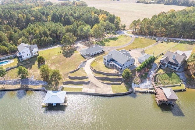 bird's eye view featuring a water view and a forest view