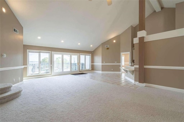 unfurnished living room with visible vents, high vaulted ceiling, baseboards, tile patterned floors, and carpet floors