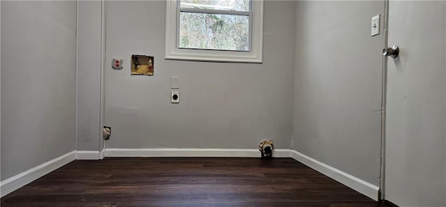 laundry room with washer hookup, dark wood-type flooring, electric dryer hookup, laundry area, and baseboards