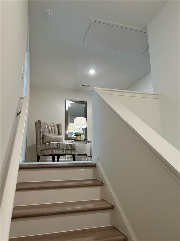 1567 Aiden Way Unit 34, Conyers, GA 30013 - stairway with attic access and recessed lighting