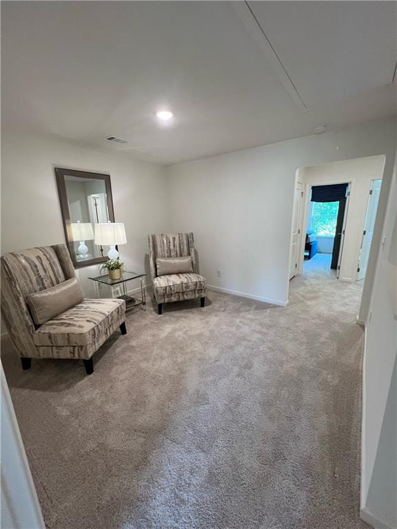 1567 Aiden Way Unit 34, Conyers, GA 30013 - living area featuring attic access, carpet floors, baseboards, and recessed lighting