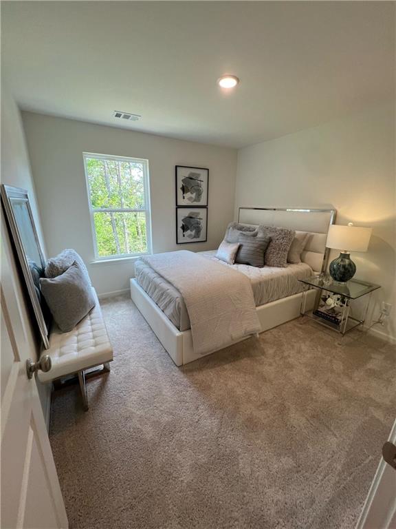 1567 Aiden Way Unit 34, Conyers, GA 30013 - carpeted bedroom with baseboards