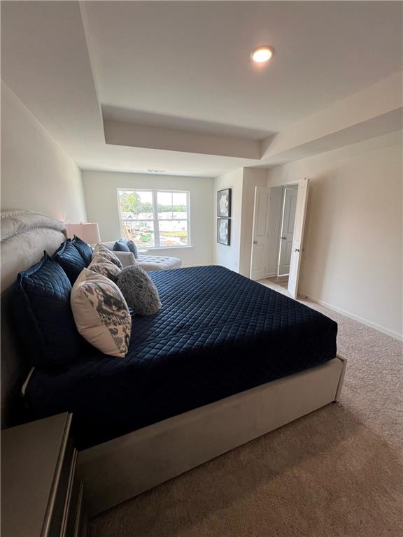1567 Aiden Way Unit 34, Conyers, GA 30013 - bedroom featuring carpet flooring, baseboards, and recessed lighting