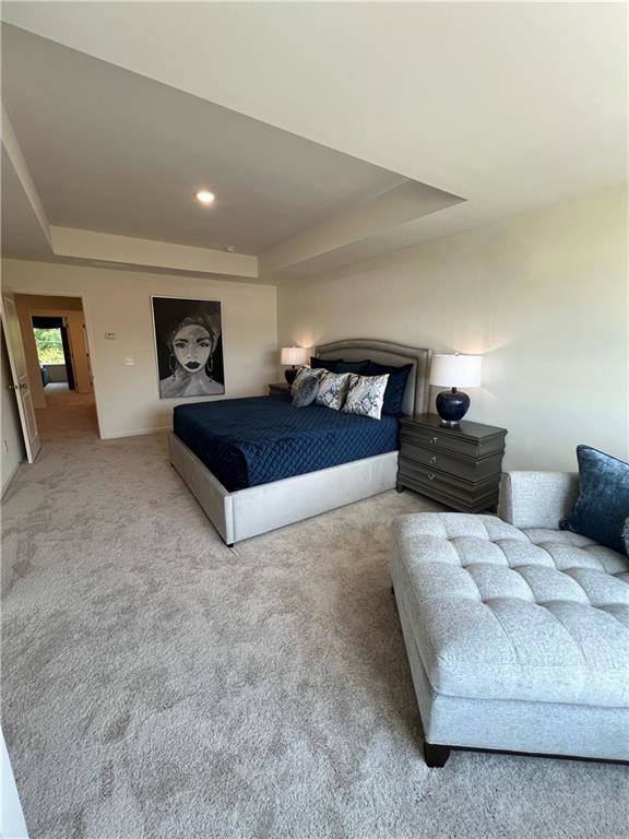 1567 Aiden Way Unit 34, Conyers, GA 30013 - carpeted bedroom with a tray ceiling and recessed lighting