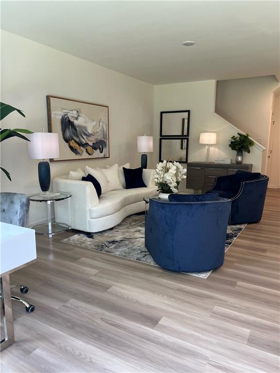 1567 Aiden Way Unit 34, Conyers, GA 30013 - living room featuring wood finished floors