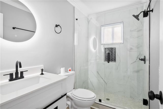 bathroom with an enclosed shower, vanity, toilet, and ornamental molding