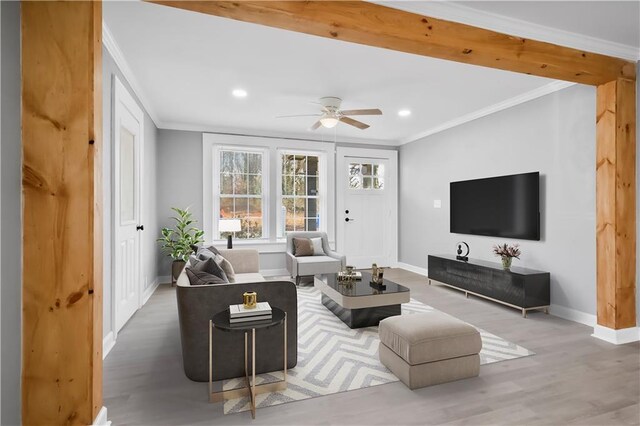 living room featuring crown molding, ceiling fan, and hardwood / wood-style flooring