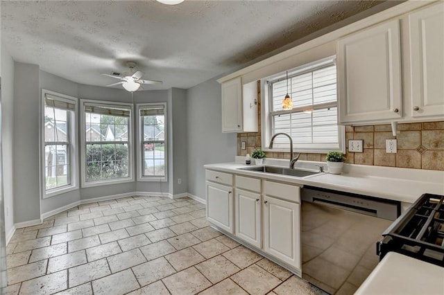 1965 Sterling Creek Ct, Snellville, GA 30078 - kitchen with stainless steel dishwasher, a sink, baseboards, backsplash, and light countertops