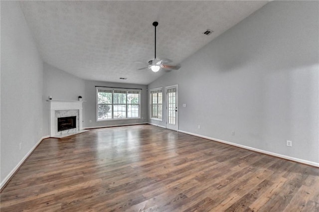 1965 Sterling Creek Ct, Snellville, GA 30078 - unfurnished living room featuring vaulted ceiling, a ceiling fan, dark wood-type flooring, baseboards, and a fireplace