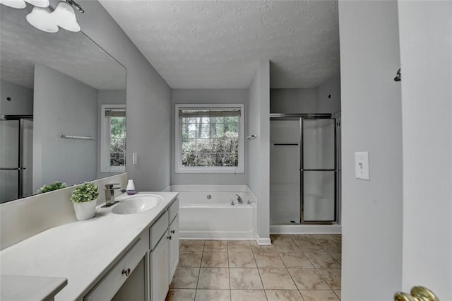 1965 Sterling Creek Ct, Snellville, GA 30078 - full bath featuring a shower stall, vanity, a garden tub, and a textured ceiling