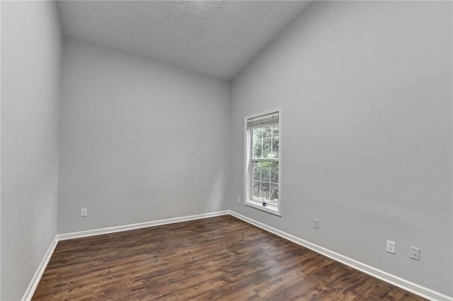 1965 Sterling Creek Ct, Snellville, GA 30078 - empty room featuring baseboards, lofted ceiling, and dark wood finished floors