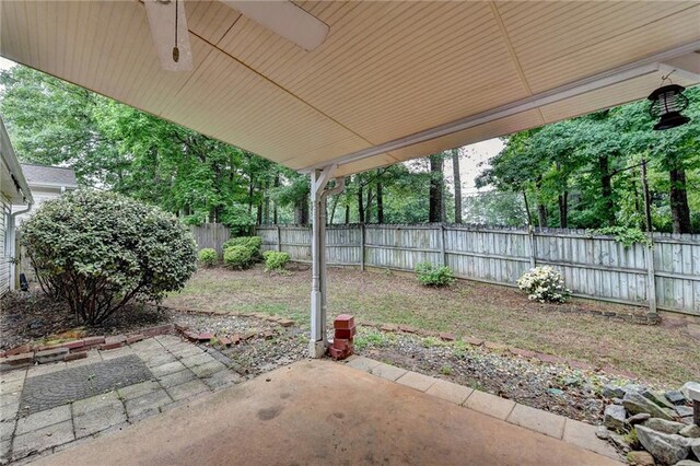 1965 Sterling Creek Ct, Snellville, GA 30078 - fenced backyard featuring a patio and ceiling fan