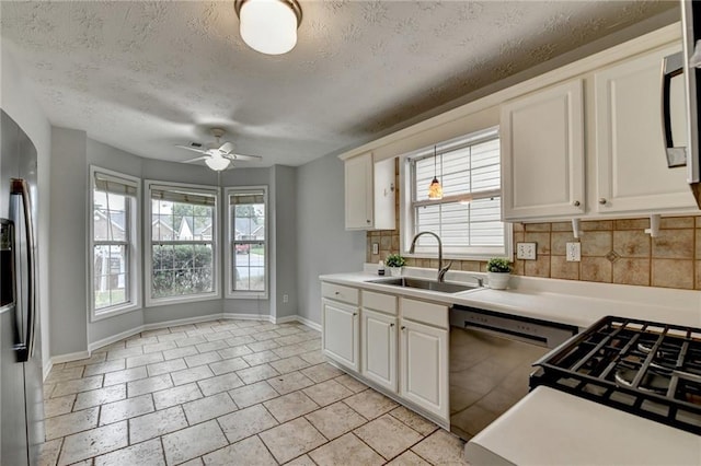 1965 Sterling Creek Ct, Snellville, GA 30078 - kitchen with a sink, appliances with stainless steel finishes, backsplash, baseboards, and a textured ceiling