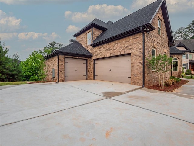 view of side of property with a garage