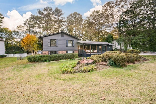 split level home featuring a front yard and covered porch