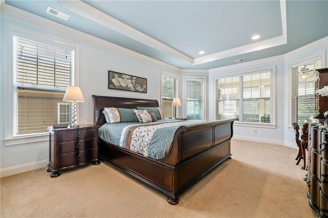 bedroom with light carpet, a tray ceiling, baseboards, ornamental molding, and recessed lighting