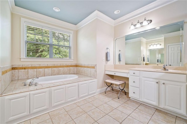 bathroom with tile patterned flooring, crown molding, a garden tub, and vanity