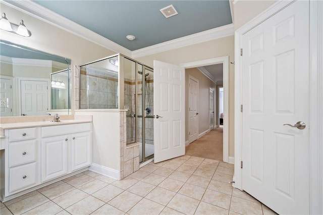 full bathroom with tile patterned floors, a shower stall, ornamental molding, vanity, and baseboards