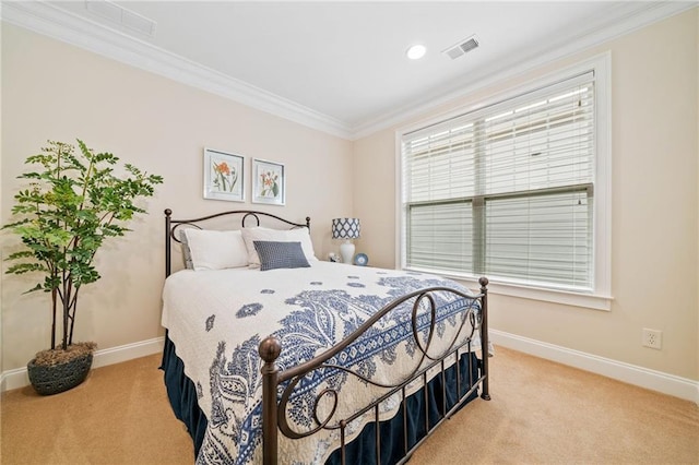 bedroom with light colored carpet, crown molding, and baseboards