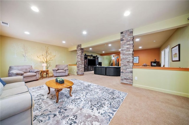 carpeted living area featuring ornate columns, recessed lighting, and baseboards