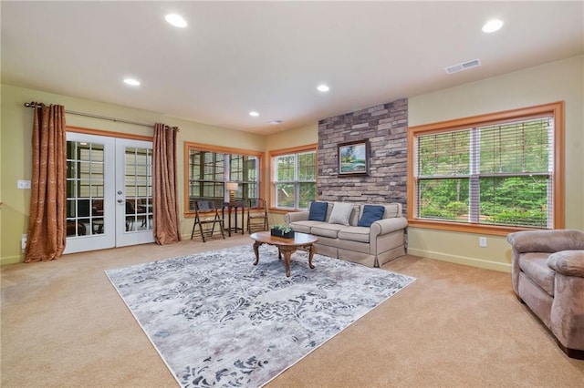 living room with carpet flooring, french doors, recessed lighting, and baseboards