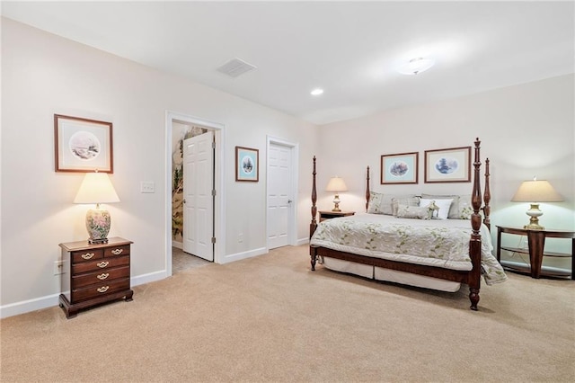 bedroom with light colored carpet, baseboards, and recessed lighting