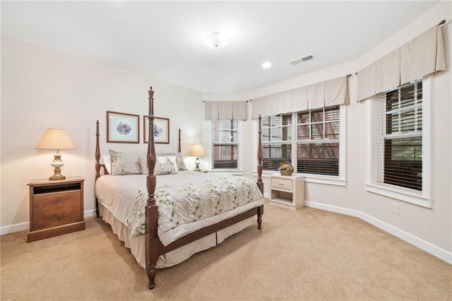 bedroom featuring light colored carpet, baseboards, and recessed lighting