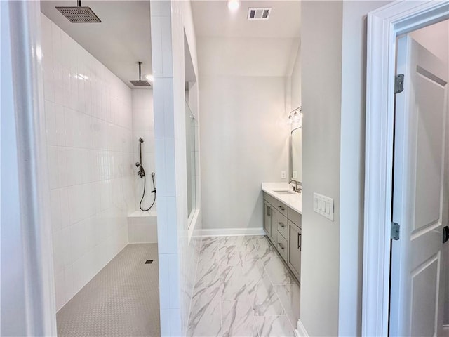 full bathroom featuring visible vents, walk in shower, marble finish floor, and vanity