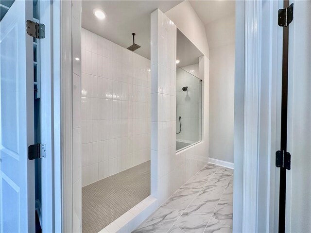 full bathroom featuring a walk in shower and marble finish floor