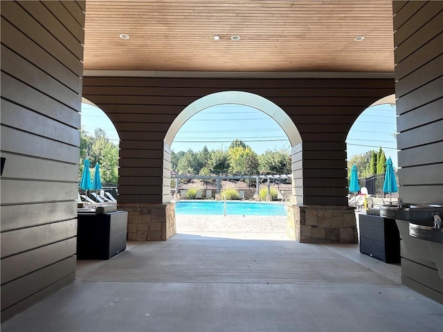 view of patio / terrace featuring an outdoor pool