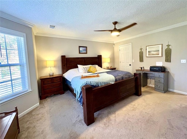 bedroom featuring light colored carpet, ornamental molding, ceiling fan, and a textured ceiling