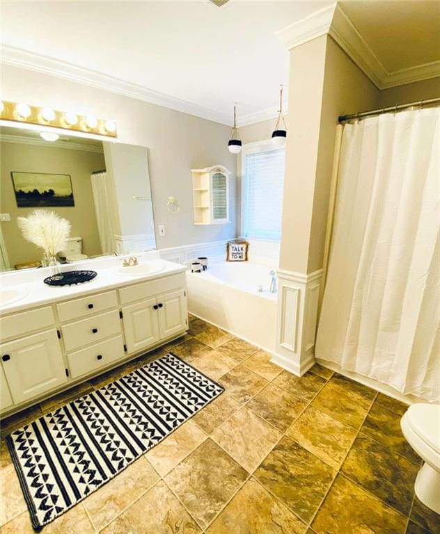 bathroom featuring ornamental molding, a tub, vanity, and toilet