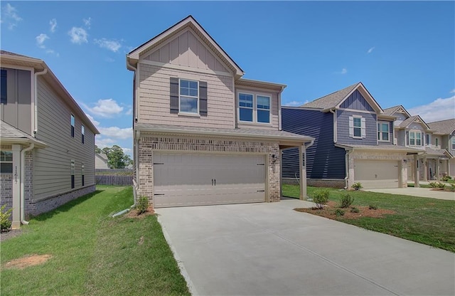 view of front of property featuring a front yard and a garage