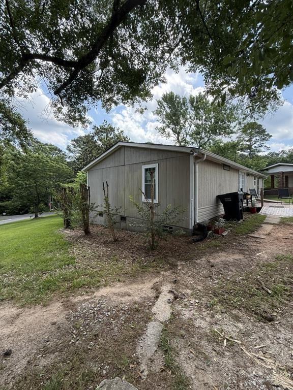 4282 By Pass, Loganville, GA 30052 - view of side of property featuring crawl space and a lawn