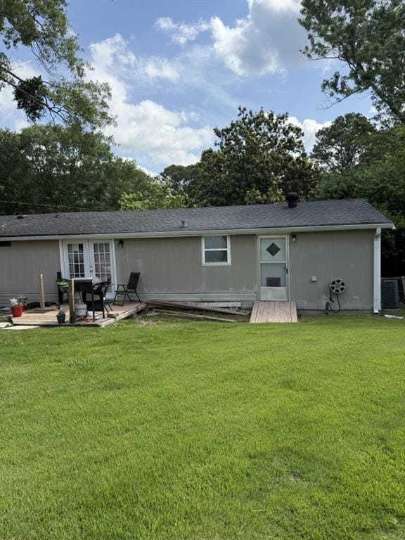 4282 By Pass, Loganville, GA 30052 - rear view of property with a lawn, a patio, and central AC