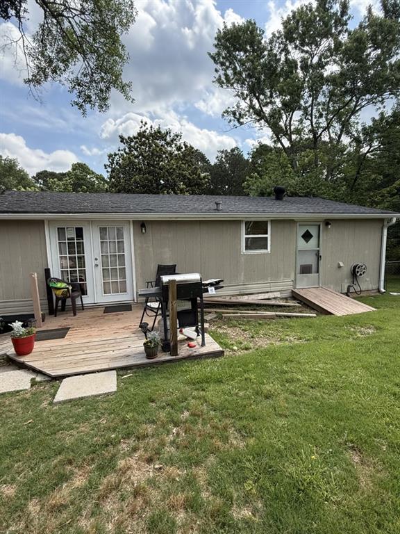 4282 By Pass, Loganville, GA 30052 - rear view of house featuring a wooden deck, french doors, and a lawn